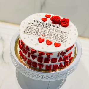 Elegant wedding anniversary cake featuring exquisite design and celebratory details.