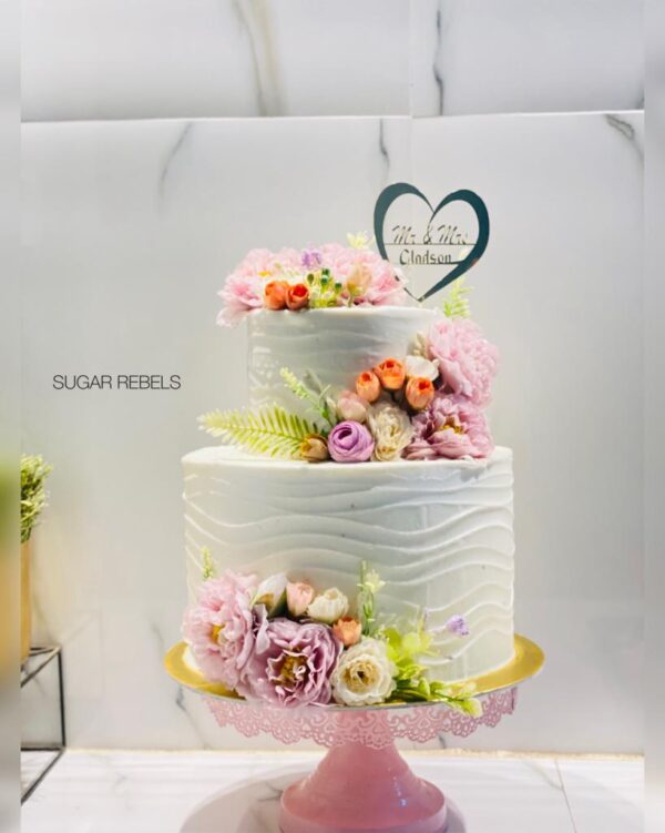 "Elegant wedding cake in Trichy featuring exquisite design and intricate details."